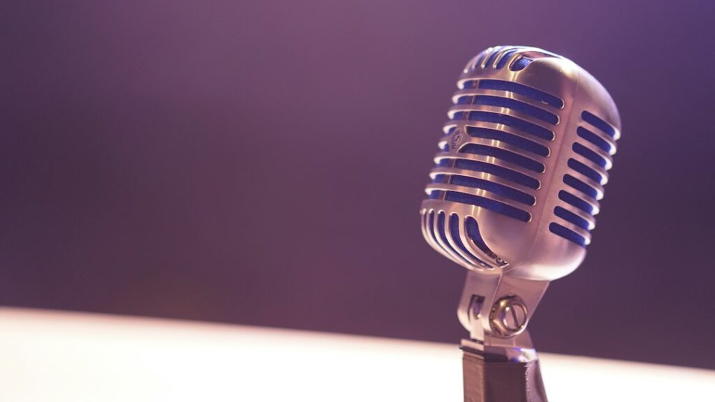 Illustrative microphone on stage, not Maria Bamford.