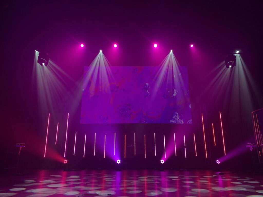 Illustrative concert lights, not a Cyndi Lauper performance