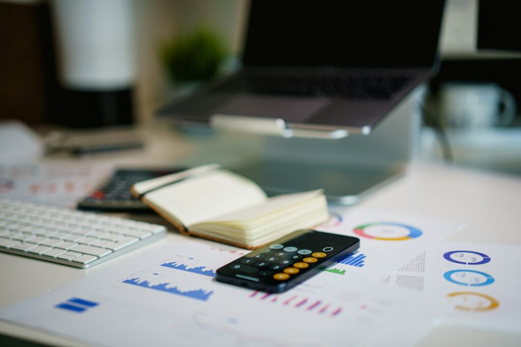 Financial documents and calculator; illustrative of recordkeeping and unrelated to Kylie Perez